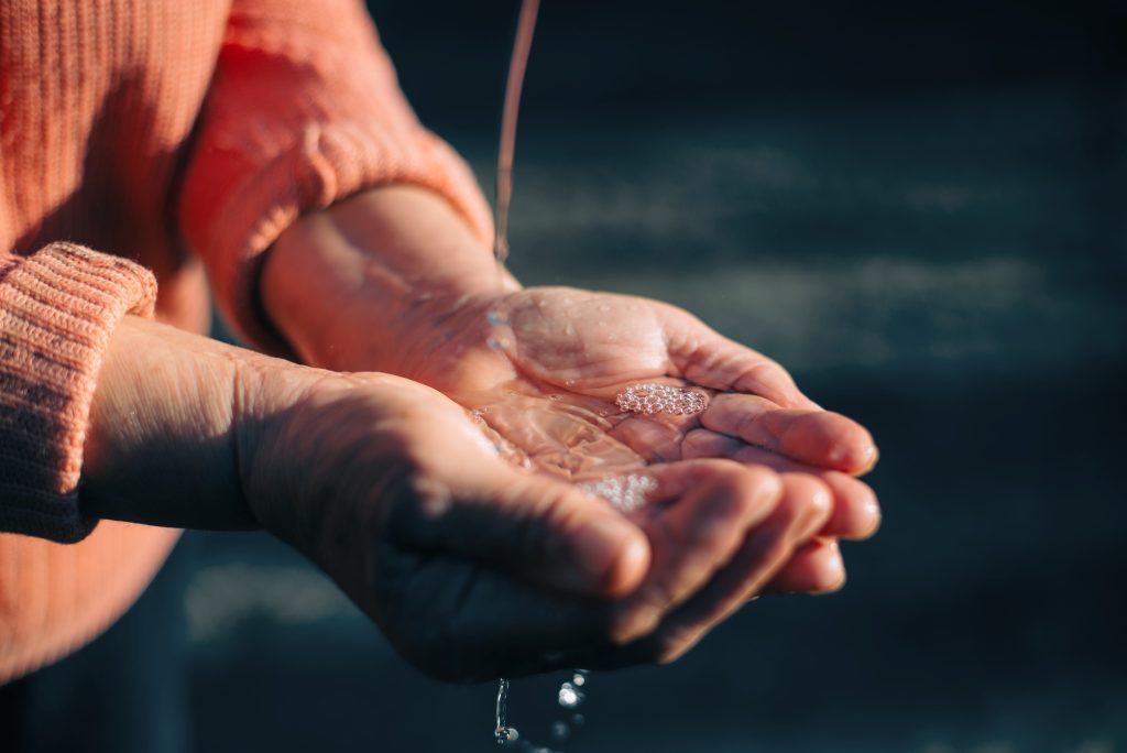 woman hands cupping water